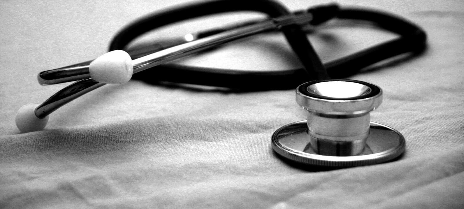 Black and white stethoscope on a white surface